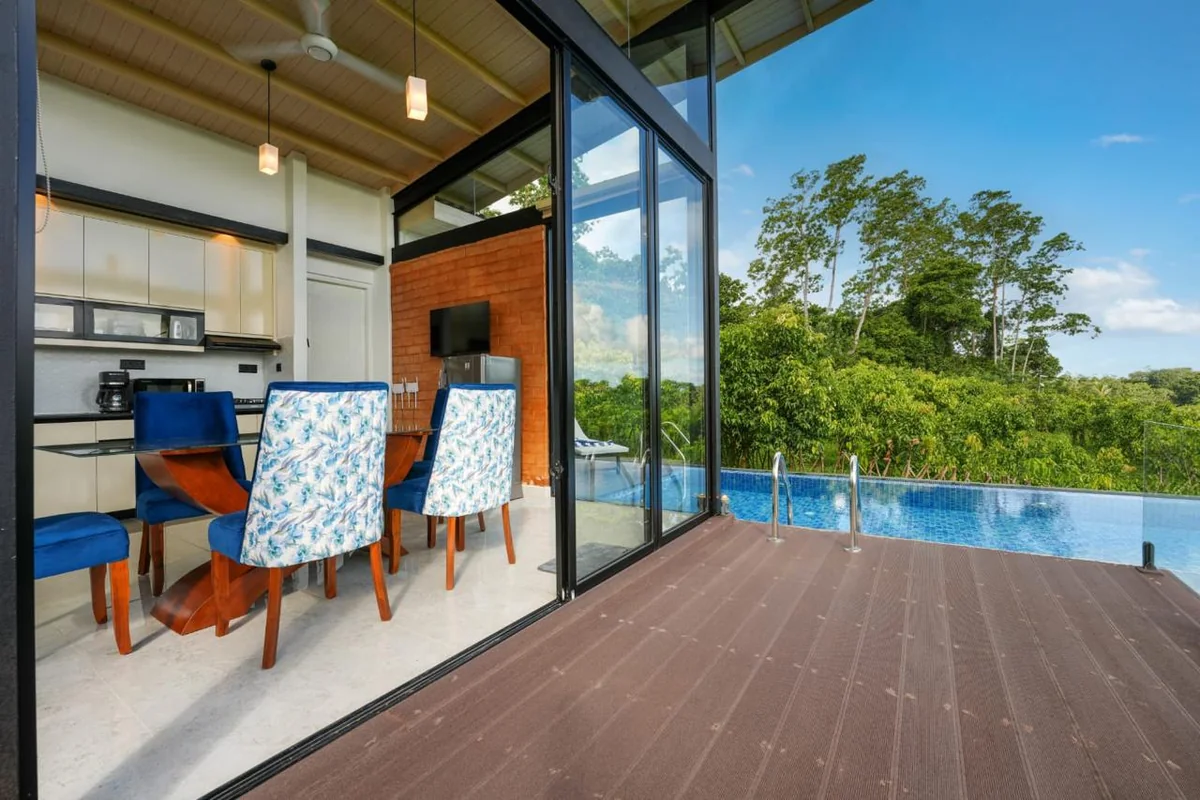 Dining area opening onto the private pool